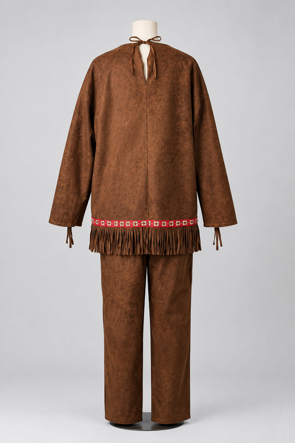 A brown faux-suede costume jacket and matching pants set displayed on a mannequin against a white fabric backdrop. The jacket features a split neckline with tie details, long sleeves, and a fringed hem with a red and white patterned trim.